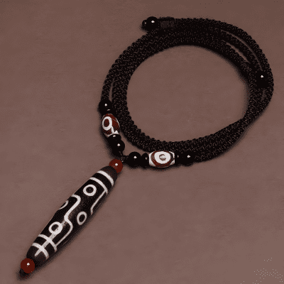 Tibetan nine-eyed dzi pendant